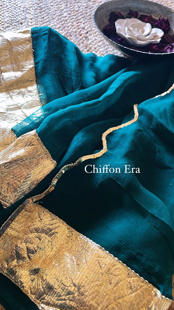 Teal blue laffa gold saree in pure chiffon fabric with crepe blouse and scallop edges