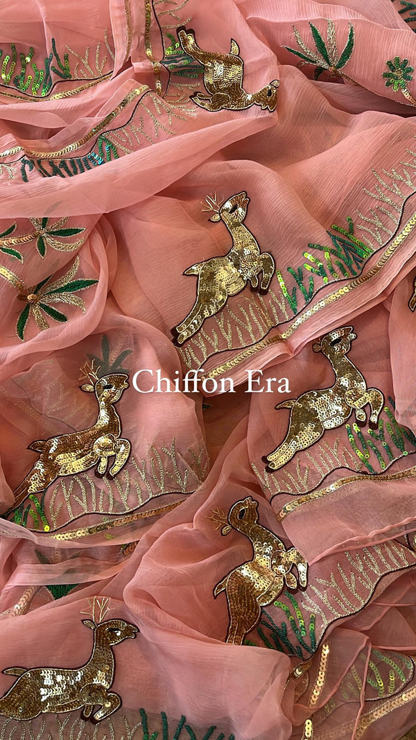 Peach pure chiffon saree adorned with Rani Blouse