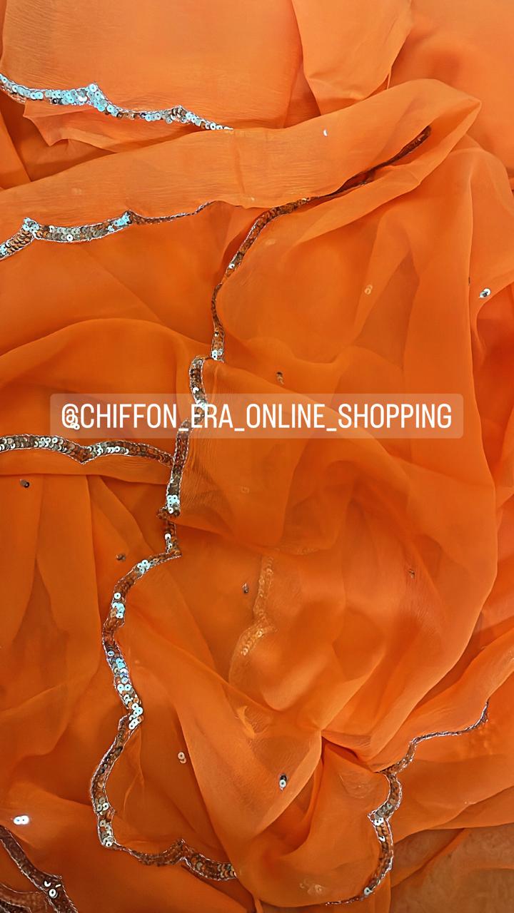 Bright orange scallop sequins saree with crepe blouse